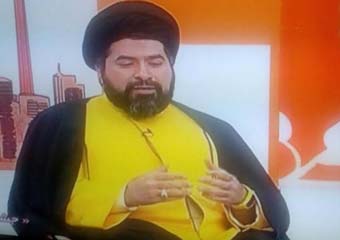 عکس/ یک روحانی با لباس و ساعت اسپورت زرد در تلویزیون !